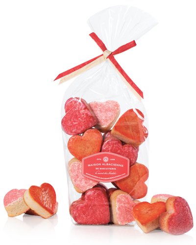 The Floralies: 3 heart-shaped soft almond biscuits, of pink, red and orange colours, with rose, poppy and hibiscus fragrances